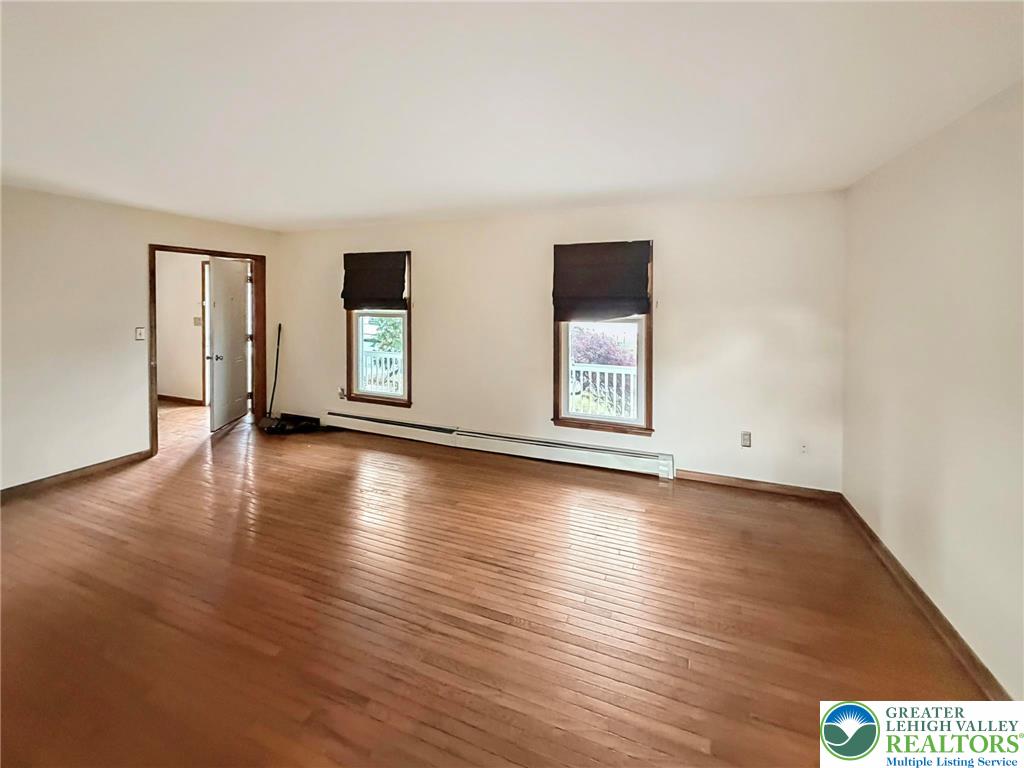 719 Hunter Street Catasauqua, PA 18032 - Photo 15 of 41 a view of a livingroom with wooden floor and window