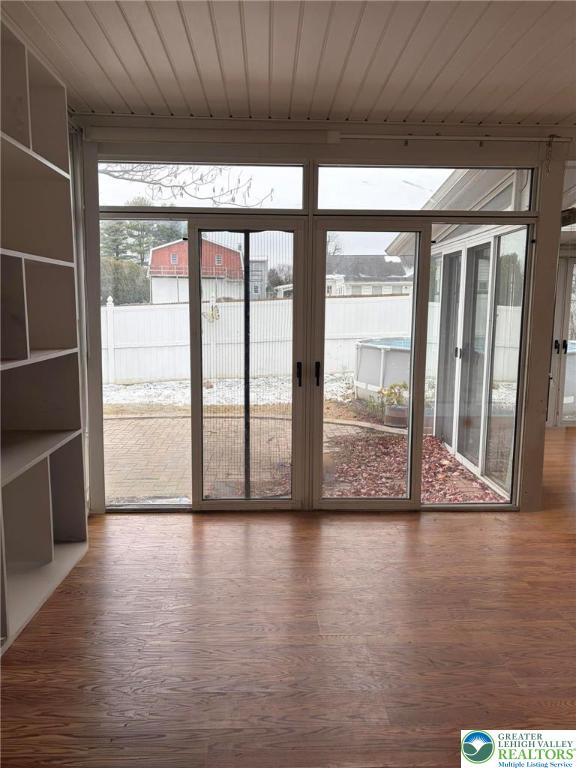 719 Hunter Street Catasauqua, PA 18032 - Photo 17 of 41 a view of an empty room with wooden floor and a window