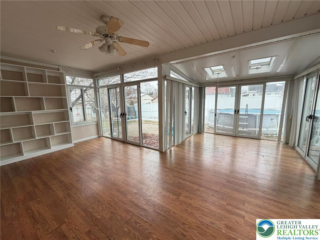 719 Hunter Street Catasauqua, PA 18032 - Photo 19 of 41 a view of an empty room with a window and wooden floor