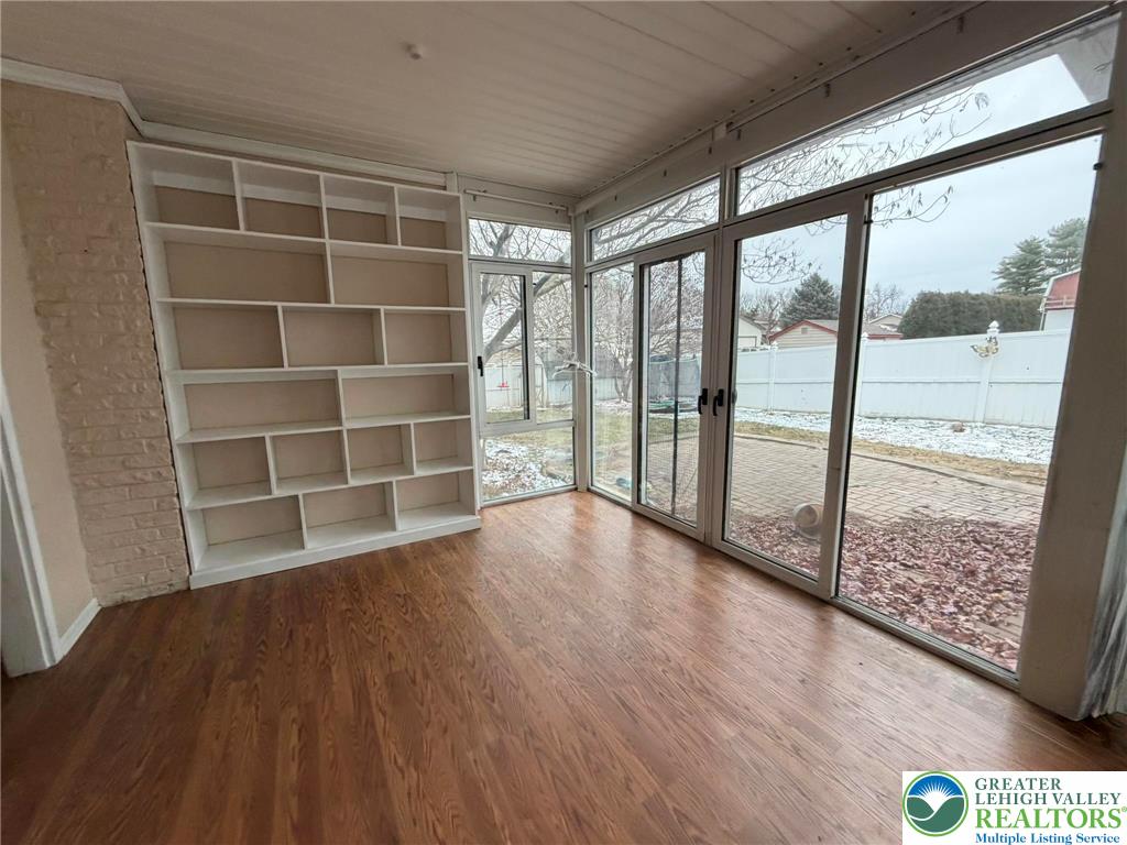719 Hunter Street Catasauqua, PA 18032 - Photo 22 of 41 a view of empty room with wooden floor and fan
