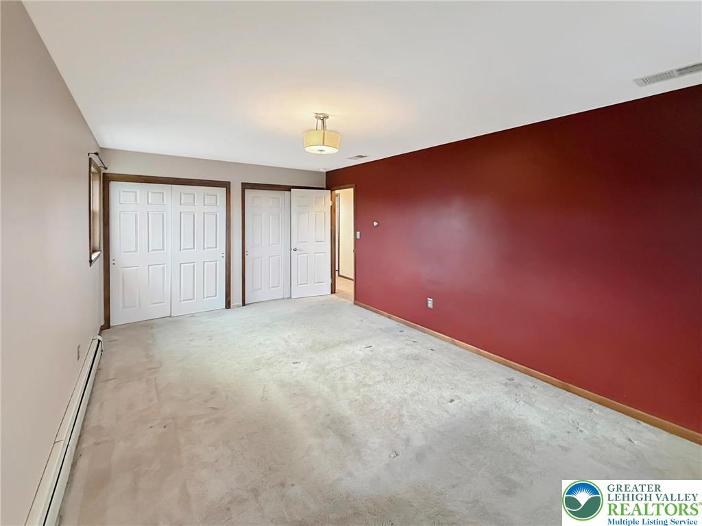 719 Hunter Street Catasauqua, PA 18032 - Photo 28 of 41 an empty room with a empty space and windows