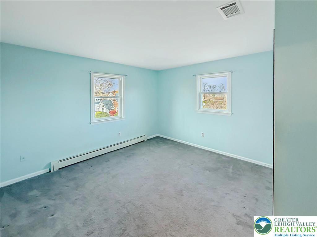 719 Hunter Street Catasauqua, PA 18032 - Photo 29 of 41 an empty room with windows