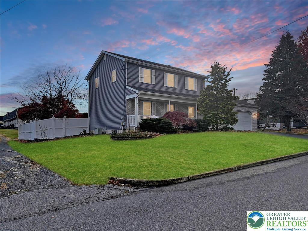 719 Hunter Street Catasauqua, PA 18032 - Photo 3 of 41 a front view of a house with a garden