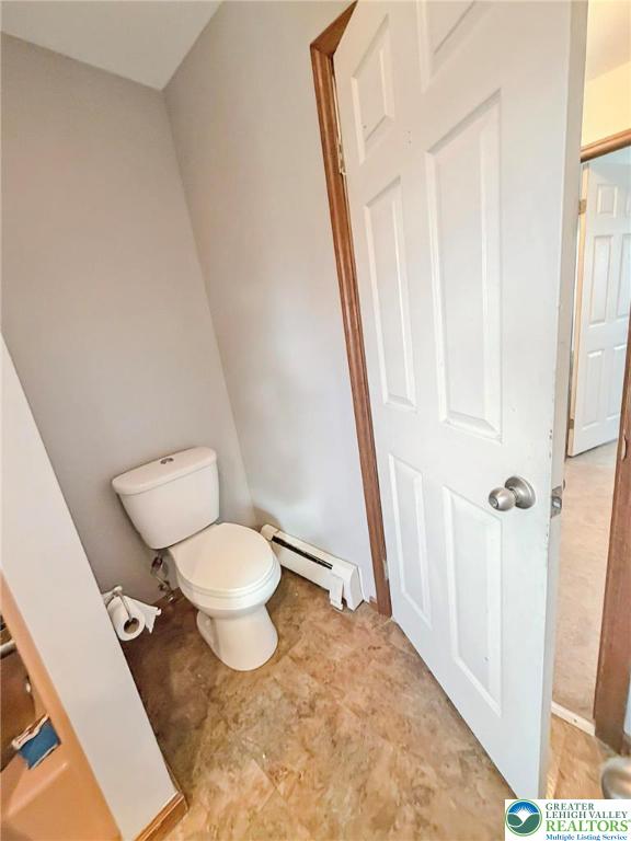 719 Hunter Street Catasauqua, PA 18032 - Photo 35 of 41 a white toilet sitting next to a small bathroom