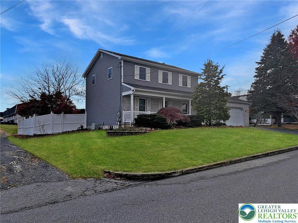 719 Hunter Street Catasauqua, PA 18032 - Photo 36 of 41 a front view of a house with a garden