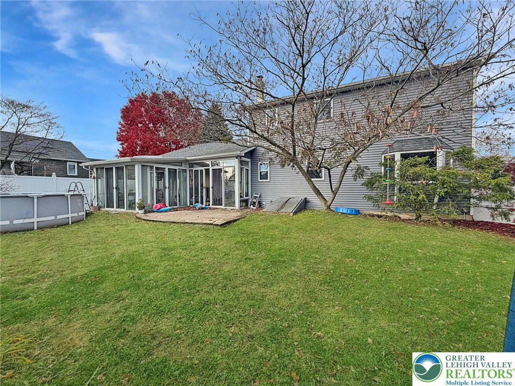 719 Hunter Street Catasauqua, PA 18032 - Photo 37 of 41 a view of a house with backyard and a tree