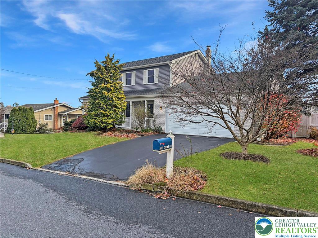 719 Hunter Street Catasauqua, PA 18032 - Photo 4 of 41 a front view of a house with garden