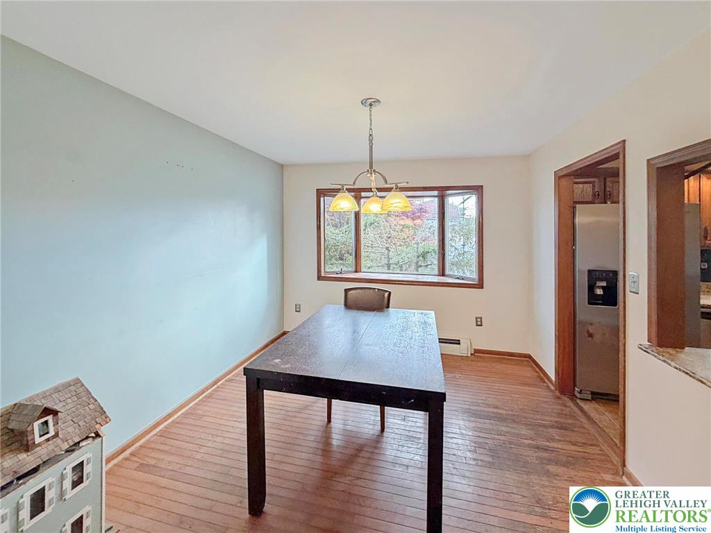719 Hunter Street Catasauqua, PA 18032 - Photo 9 of 41 a view of a dining room with furniture window and wooden floor