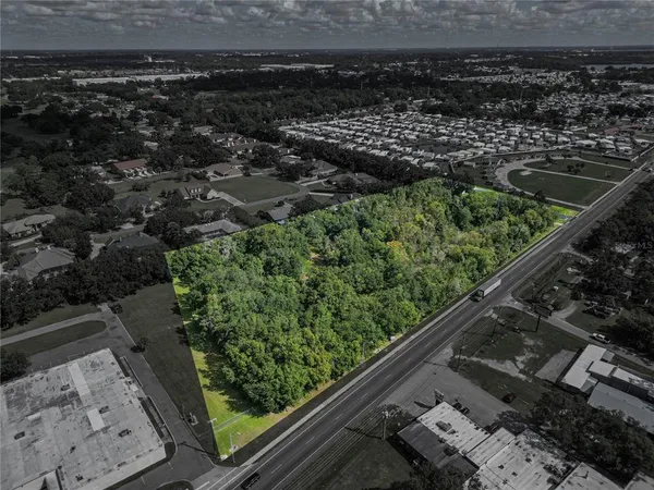 an aerial view of a yard with a lake view