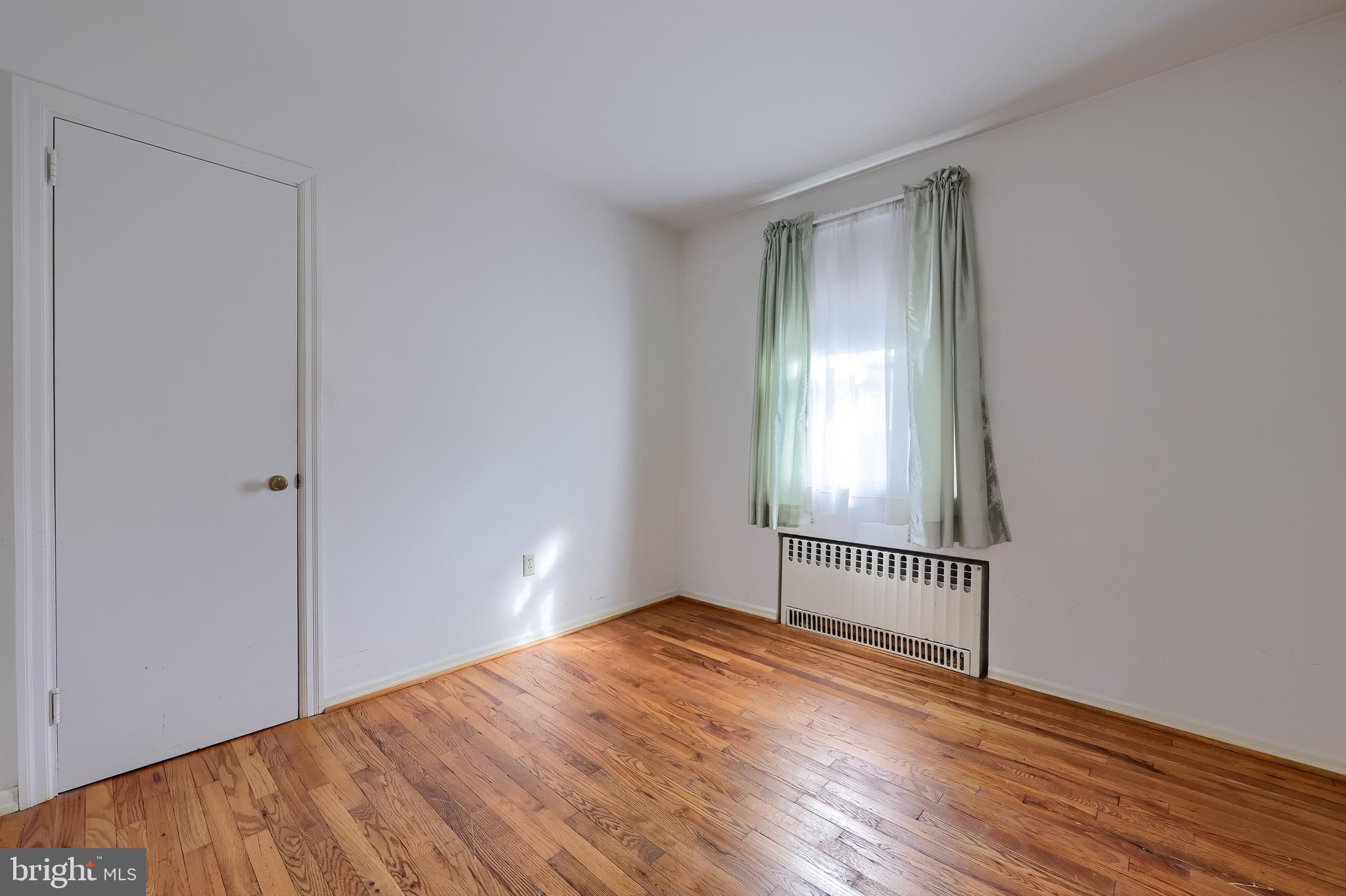 281 West Walnut Street Marietta, PA 17547 - Photo 13 of 17 a view of empty room with wooden floor