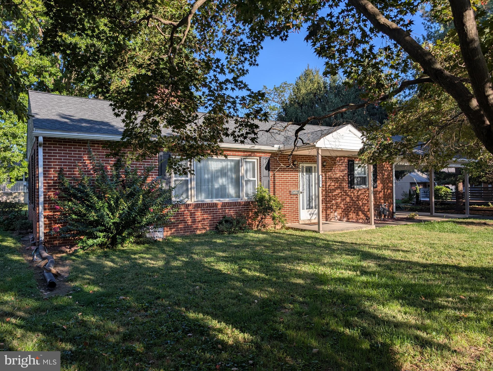 281 West Walnut Street Marietta, PA 17547 - Photo 3 of 17 a view of a house with a big yard and large trees