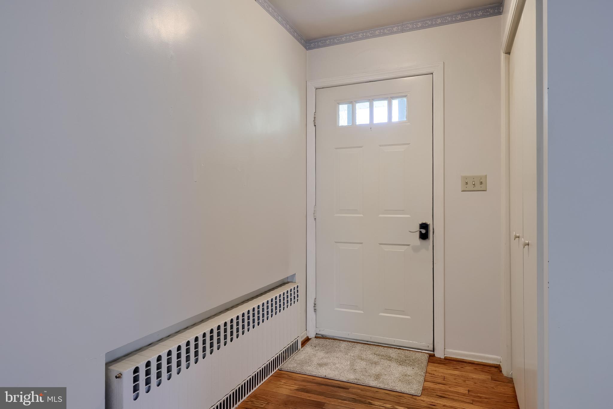 281 West Walnut Street Marietta, PA 17547 - Photo 6 of 17 a view of a hallway with wooden floor and staircase