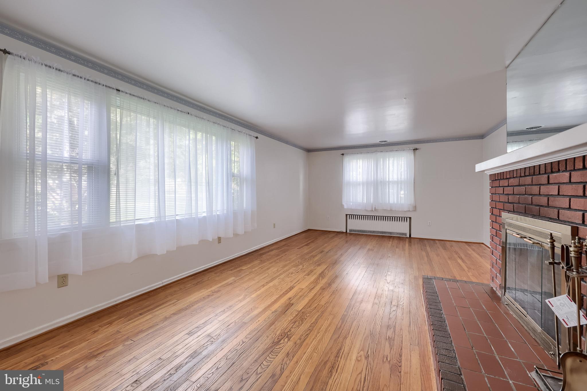 281 West Walnut Street Marietta, PA 17547 - Photo 7 of 17 wooden floor in an empty room with a window