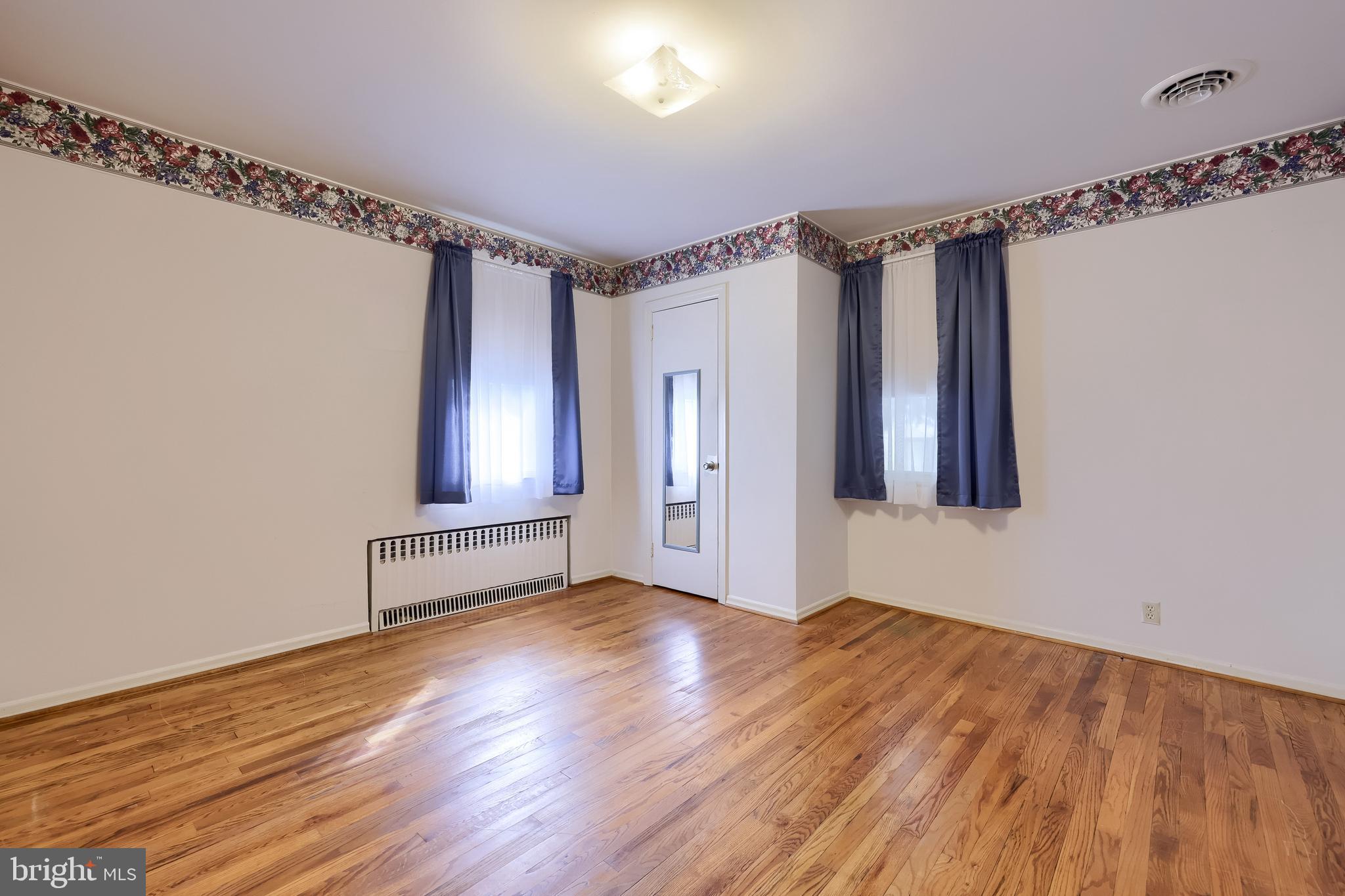 281 West Walnut Street Marietta, PA 17547 - Photo 9 of 17 a view of empty room with wooden floor and fan