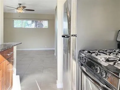 a kitchen with a stove and a refrigerator