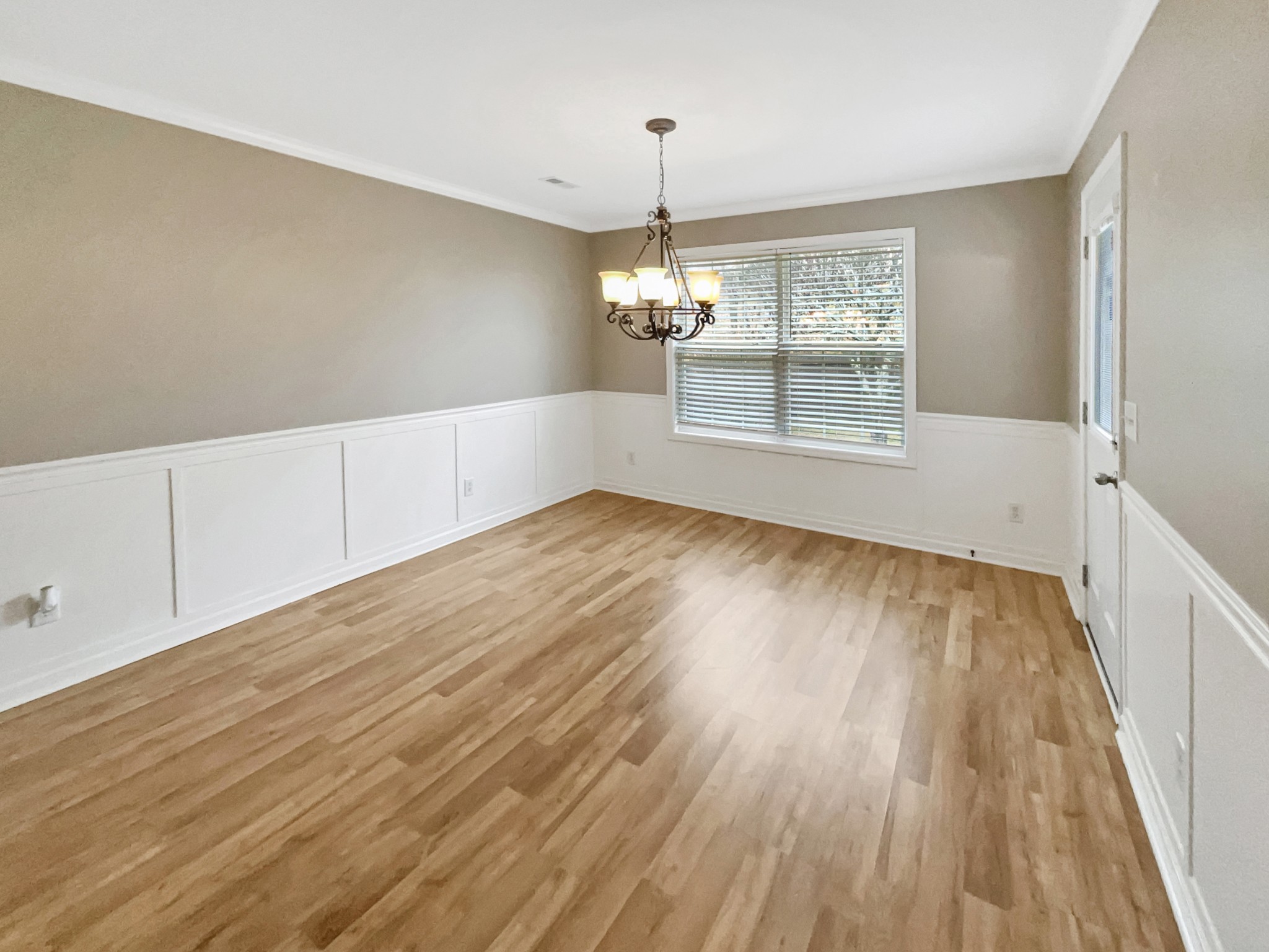 4022 Kristen Street Spring Hill, TN 37174 - Photo 11 of 23 an empty room with wooden floor and windows
