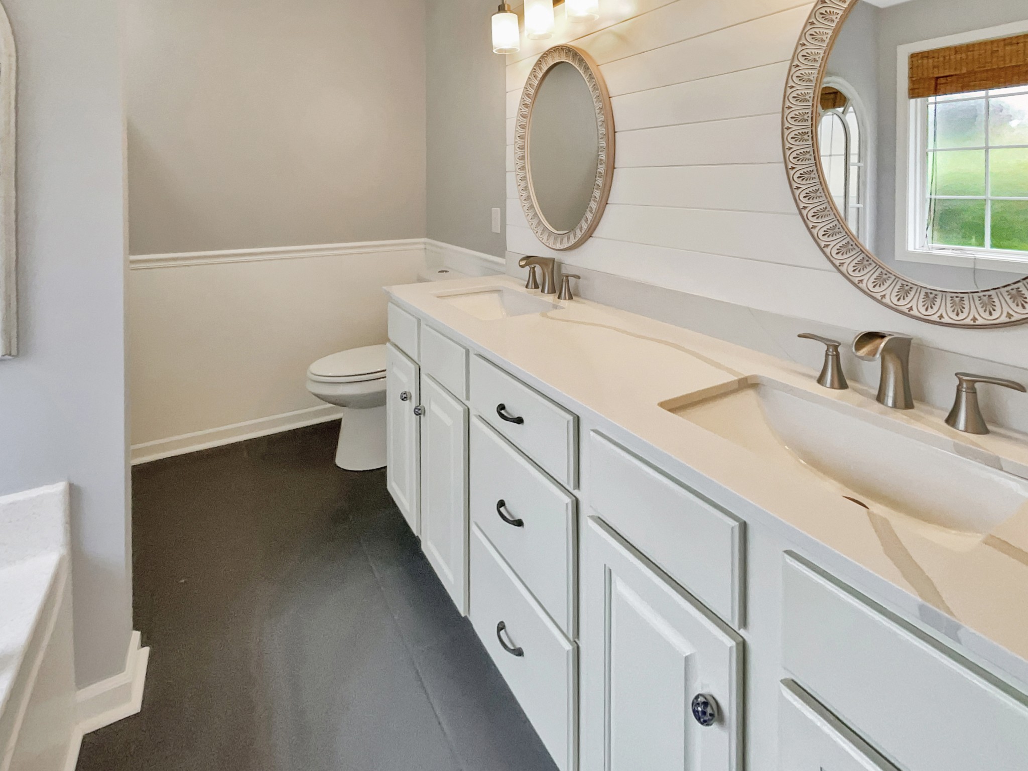 4022 Kristen Street Spring Hill, TN 37174 - Photo 13 of 23 a spacious bathroom with a double vanity sink and a mirror