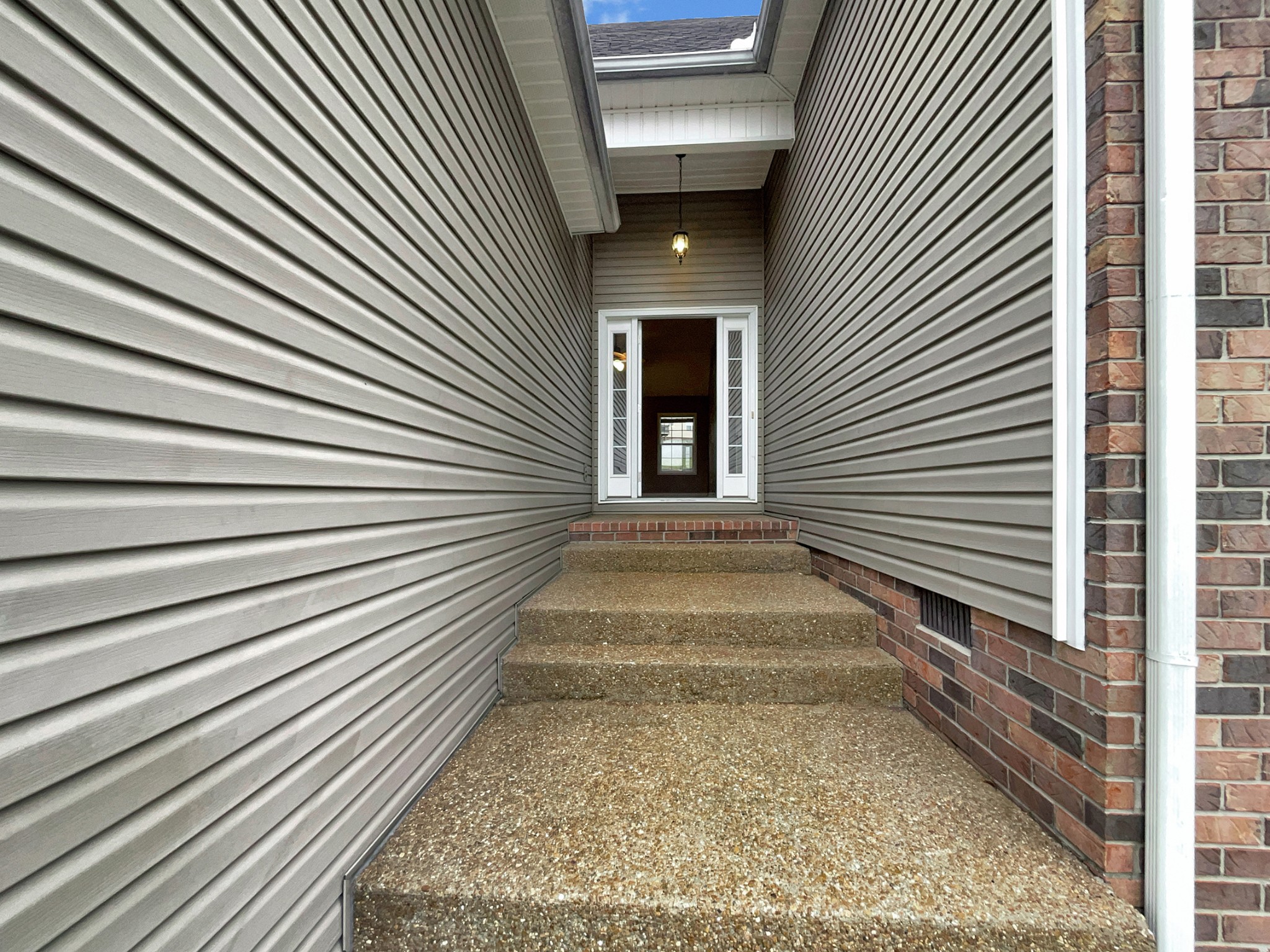 4022 Kristen Street Spring Hill, TN 37174 - Photo 3 of 23 a view of a pathway of a house with wooden floor and a large window