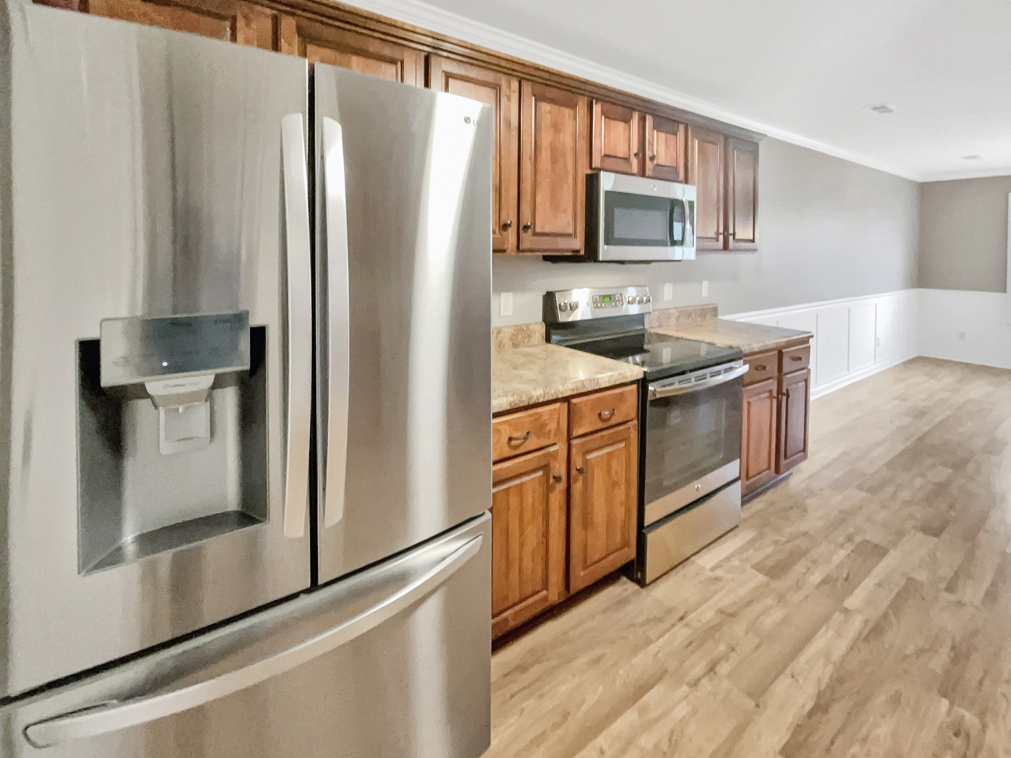4022 Kristen Street Spring Hill, TN 37174 - Photo 9 of 23 a kitchen with stainless steel appliances granite countertop a refrigerator stove and sink
