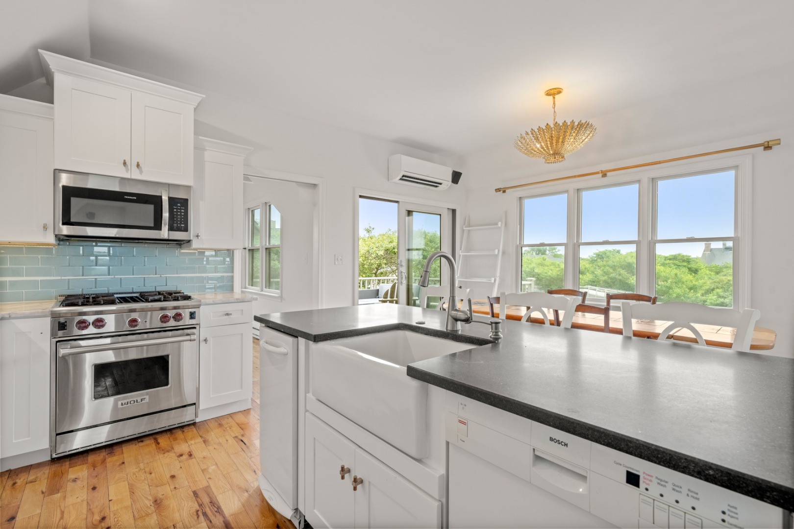4 Berkley Street Nantucket, MA 02554 - Photo 21 of 47 a kitchen with sink stove and microwave