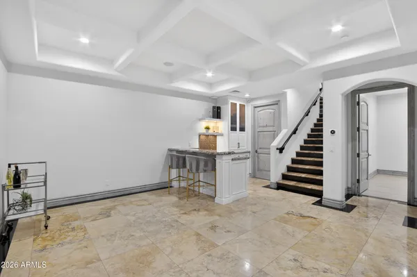a lobby with furniture and wooden floor