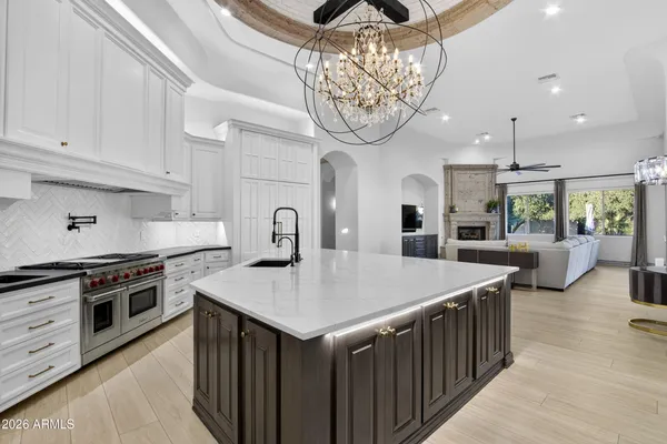 a stove top oven sitting inside of a kitchen