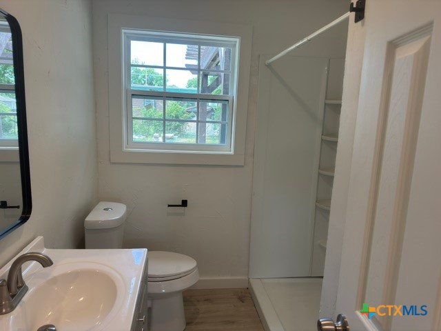 602 South 26th Street Temple, TX 76501 - Photo 11 of 11 a white toilet sitting next to a bathroom sink