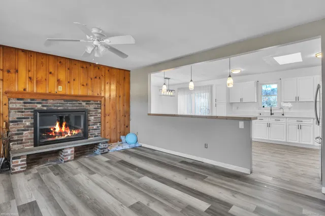 a view of kitchen with fireplace and a window
