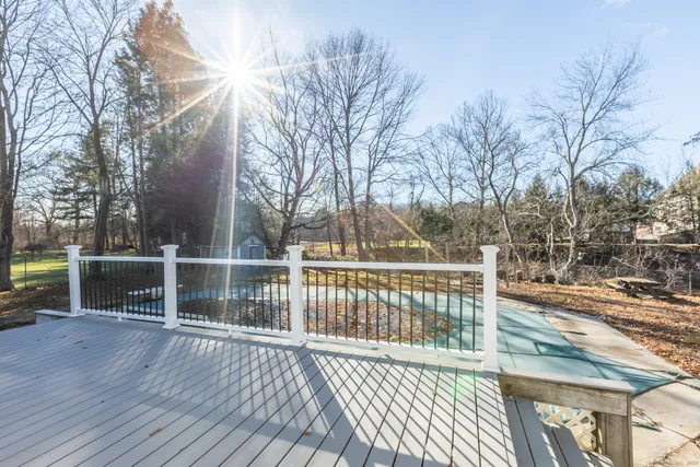 a view of a balcony with wooden floor