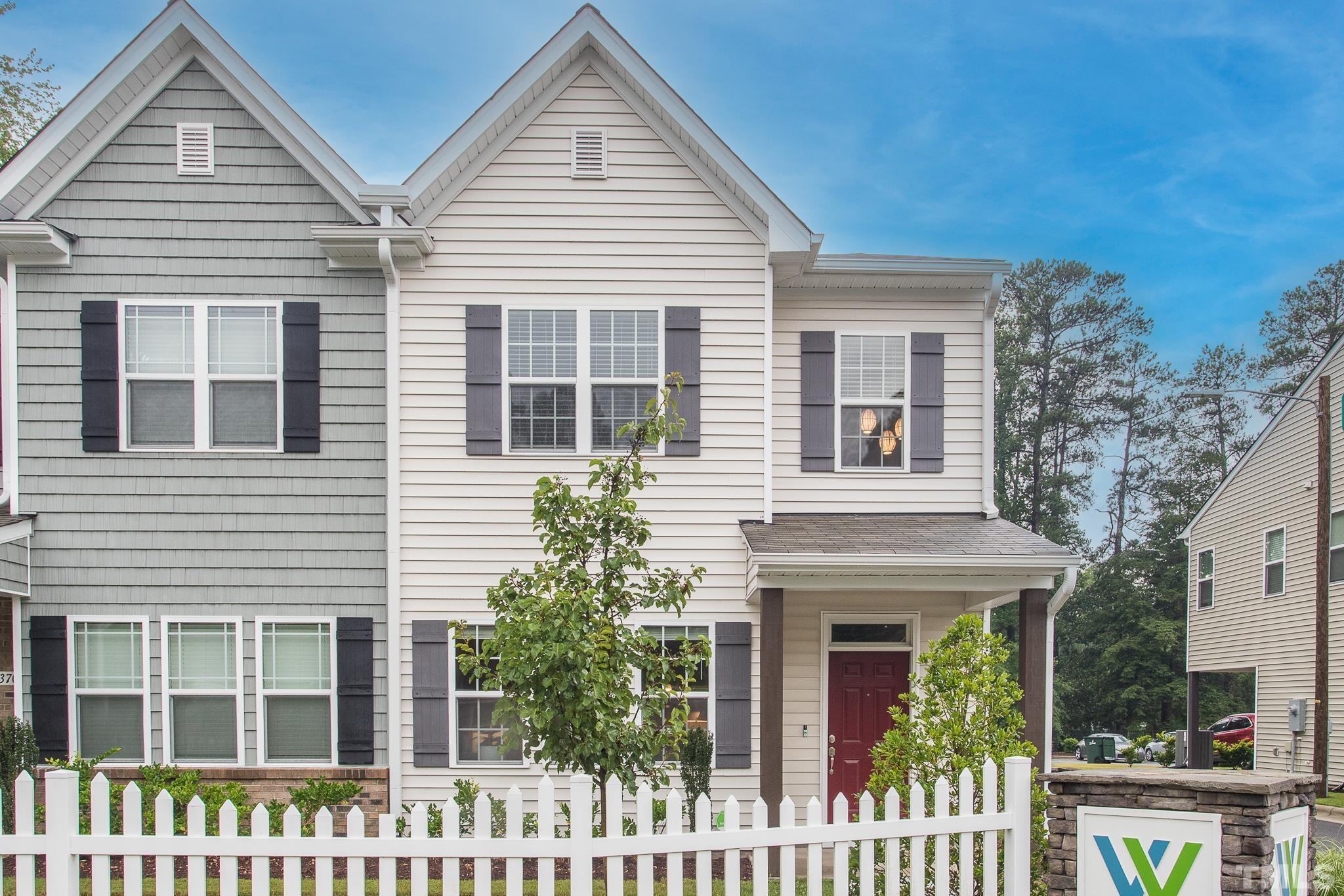 3700 Buffaloe Road Raleigh, NC 27604 - Photo 1 of 30 a front view of a house with a garden