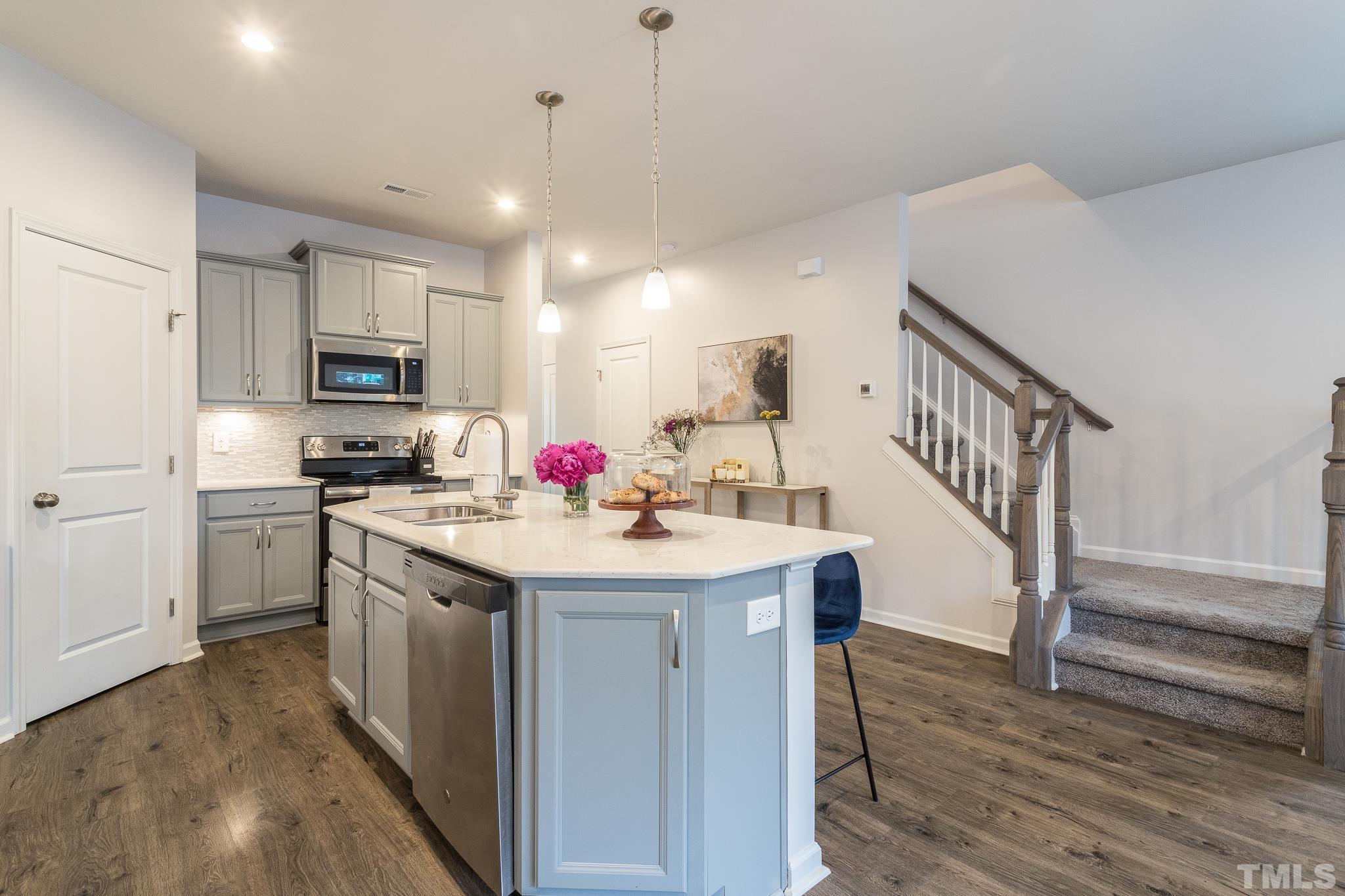 3700 Buffaloe Road Raleigh, NC 27604 - Photo 11 of 30 a kitchen with granite countertop a sink cabinets and stainless steel appliances