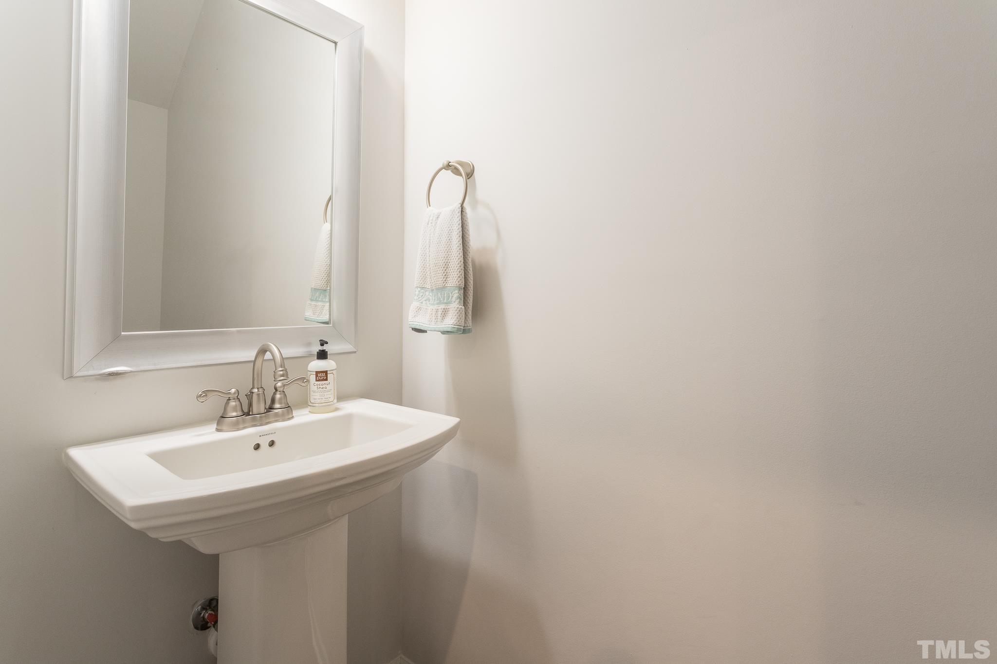 3700 Buffaloe Road Raleigh, NC 27604 - Photo 13 of 30 a bathroom with a sink and a mirror