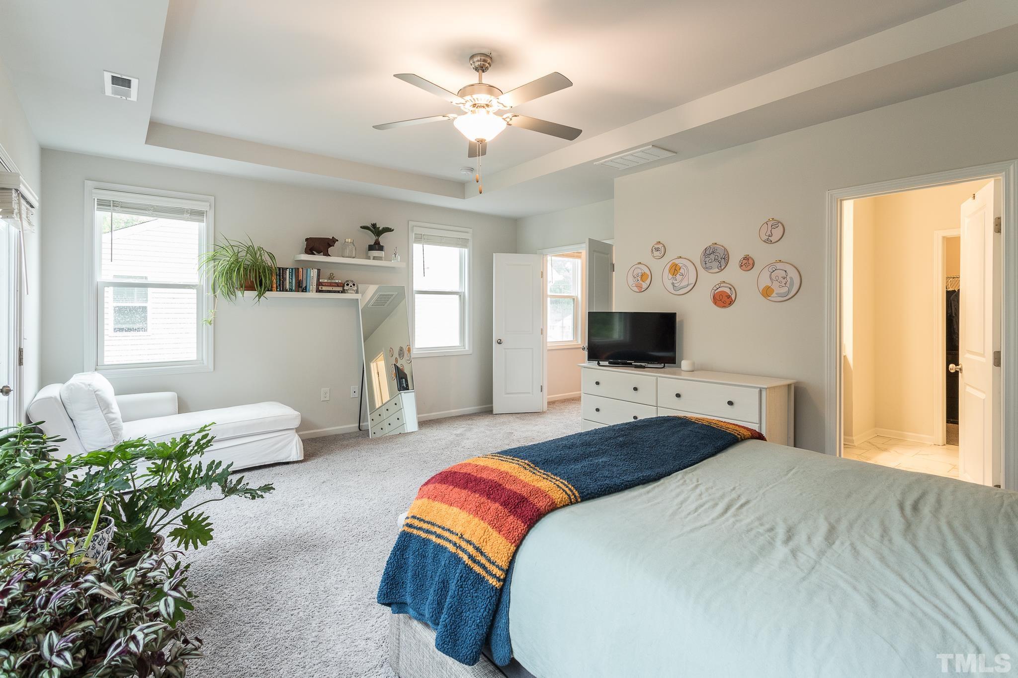 3700 Buffaloe Road Raleigh, NC 27604 - Photo 16 of 30 a bedroom with a bed couch and window