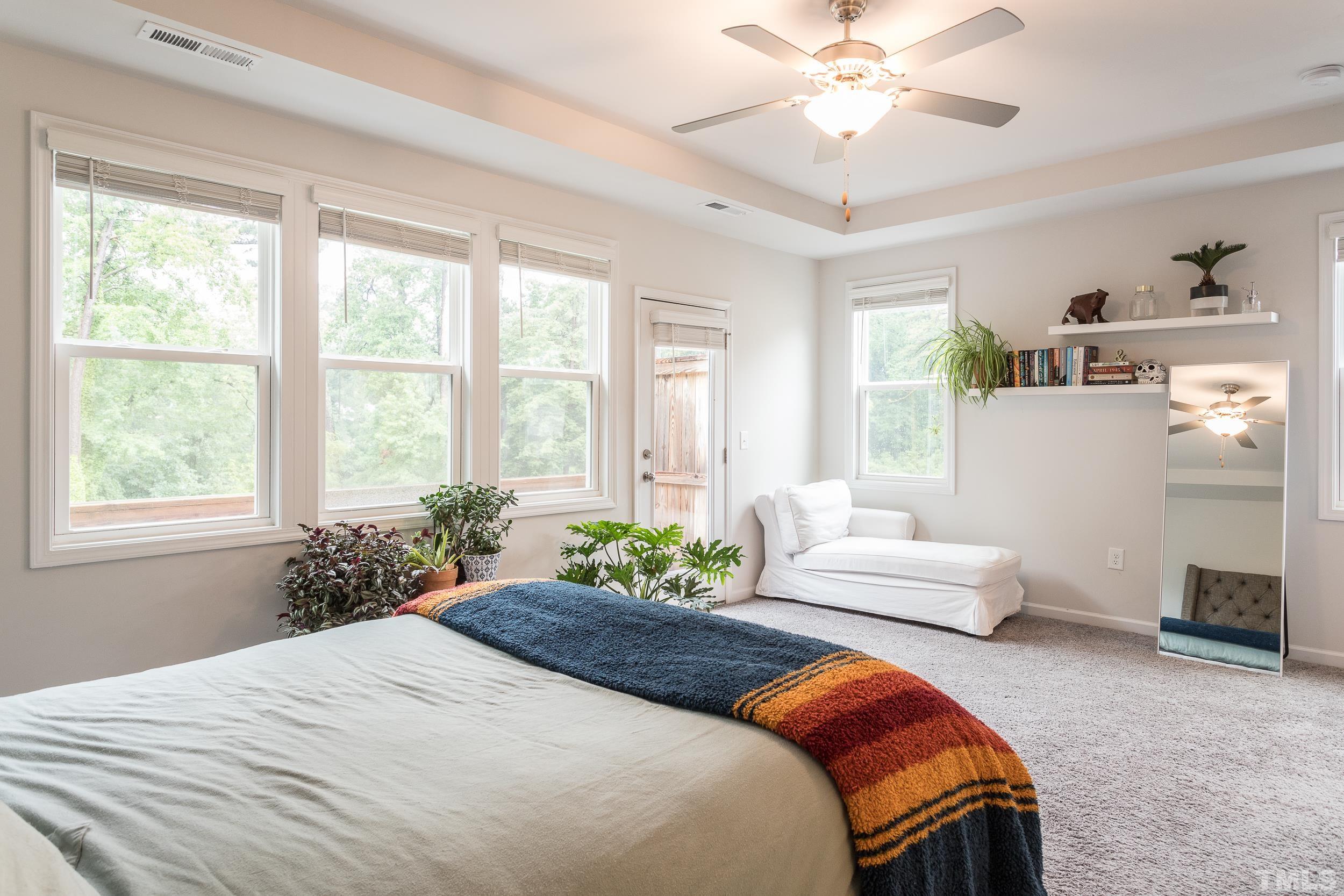 3700 Buffaloe Road Raleigh, NC 27604 - Photo 17 of 30 a bedroom with a bed and ceiling fan
