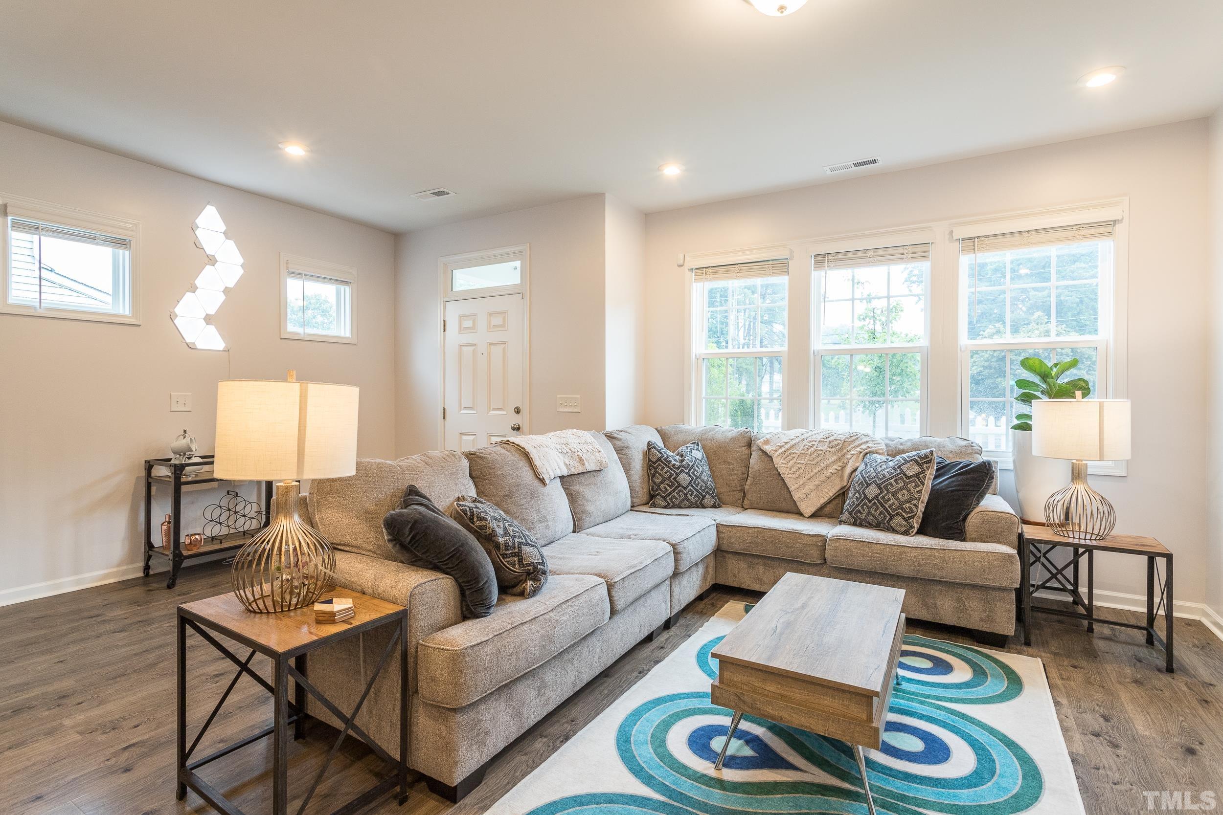 3700 Buffaloe Road Raleigh, NC 27604 - Photo 4 of 30 a living room with furniture and a large window
