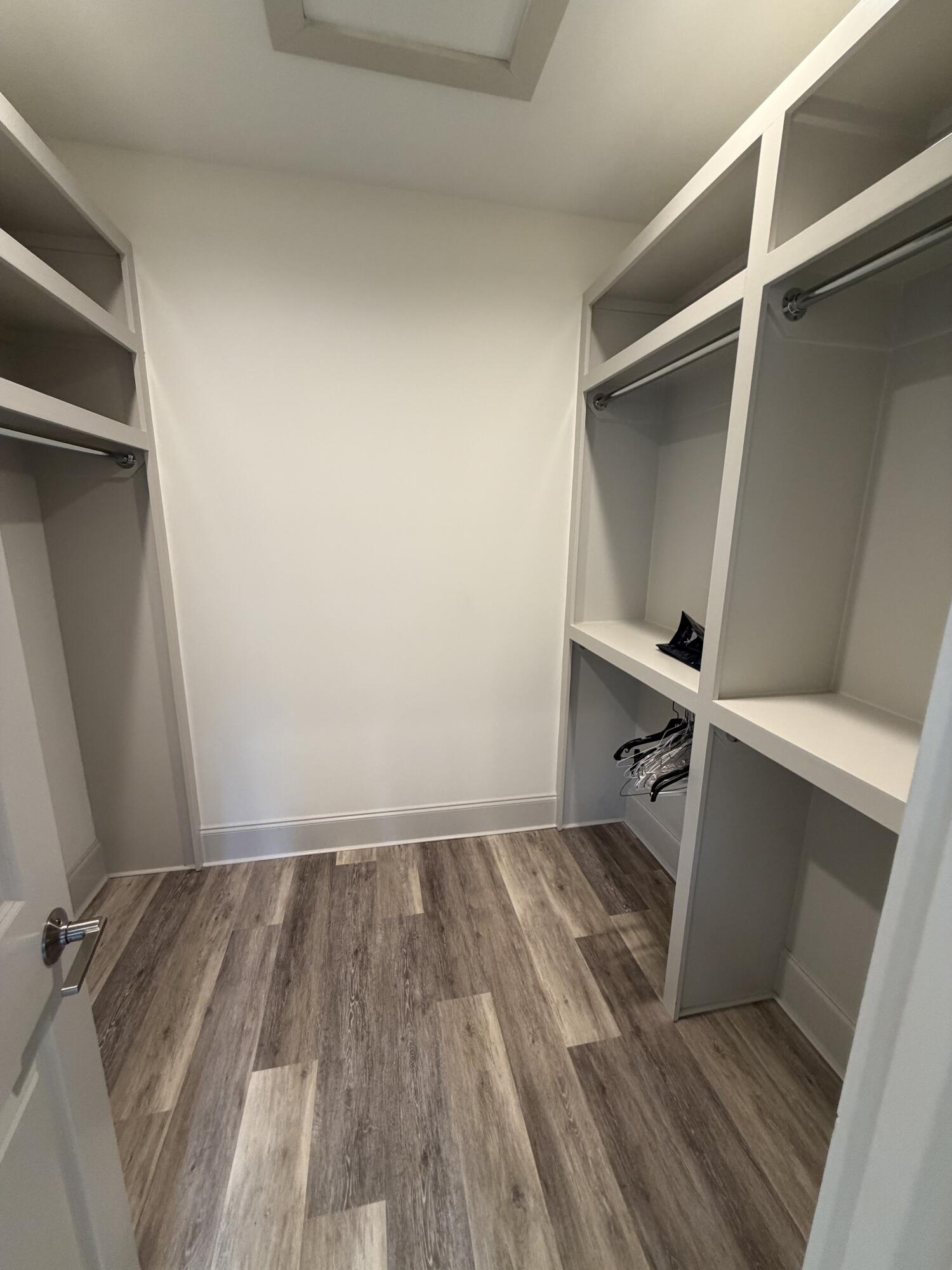 67 Heron's Crossing Santa Rosa Beach, FL 32459 - Photo 8 of 16 a room with wooden floor and white walls