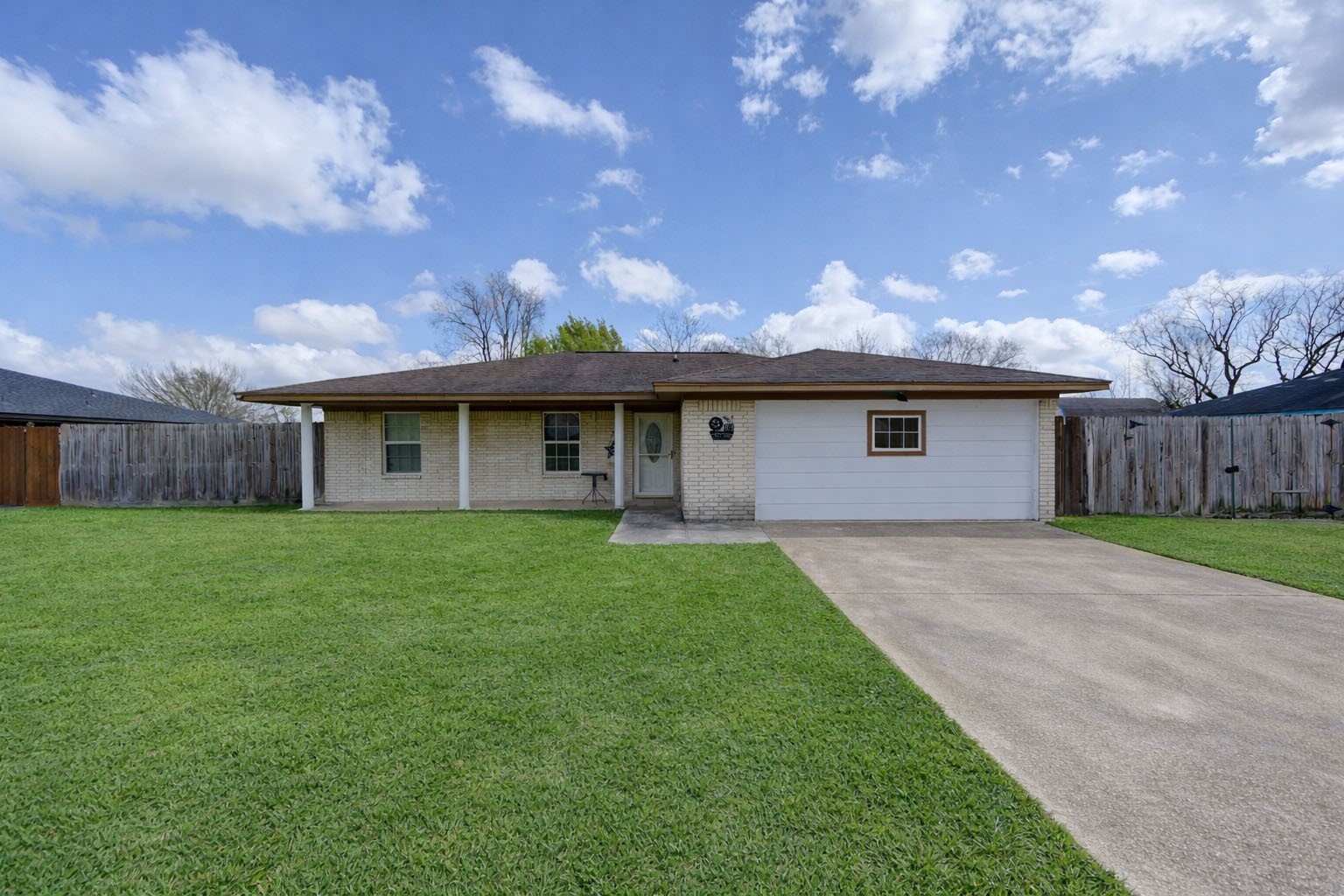 8610 Bluebonnet Street Highlands, TX 77562 - Photo 1 of 45 a front view of a house with a garden