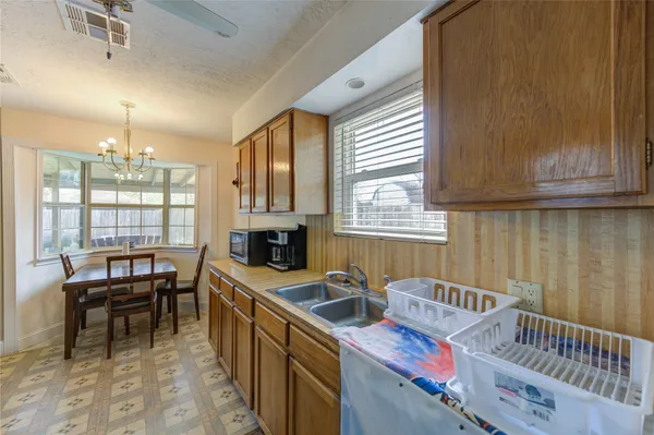 a kitchen with sink cabinets and window