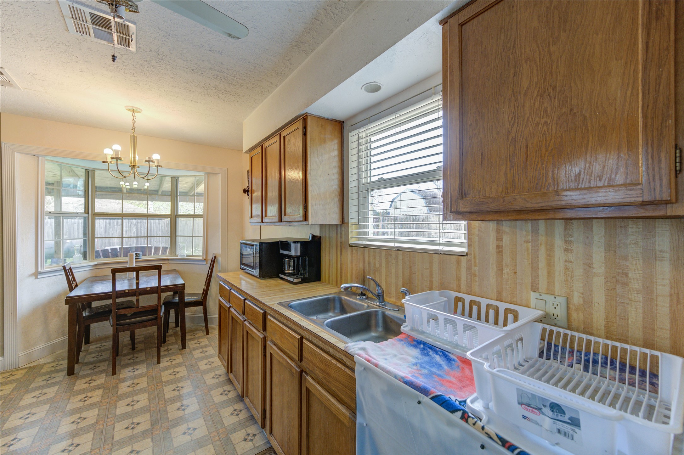 8610 Bluebonnet Street Highlands, TX 77562 - Photo 12 of 45 a kitchen with sink cabinets and window