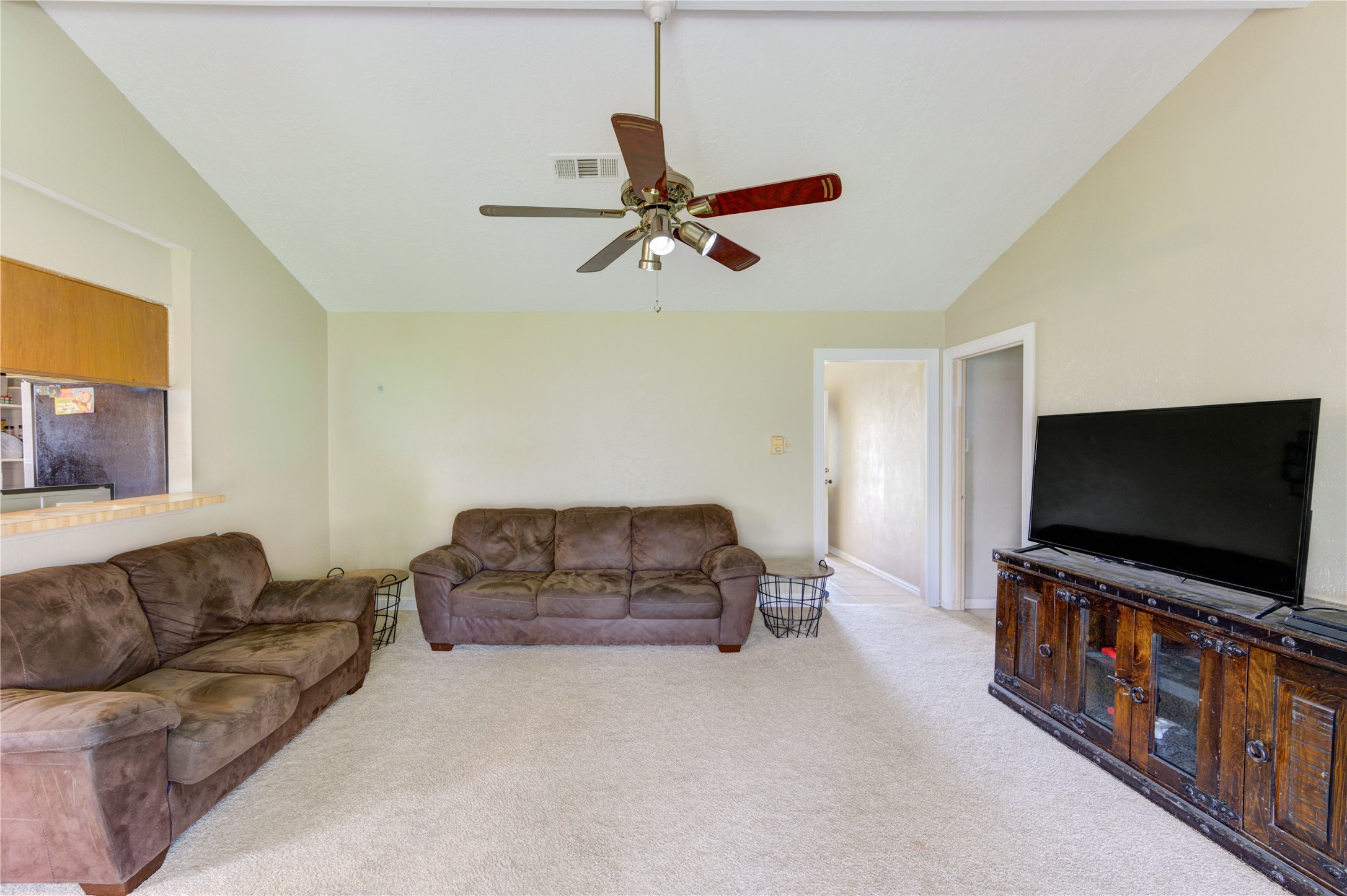 8610 Bluebonnet Street Highlands, TX 77562 - Photo 15 of 45 a living room with furniture and a flat screen tv