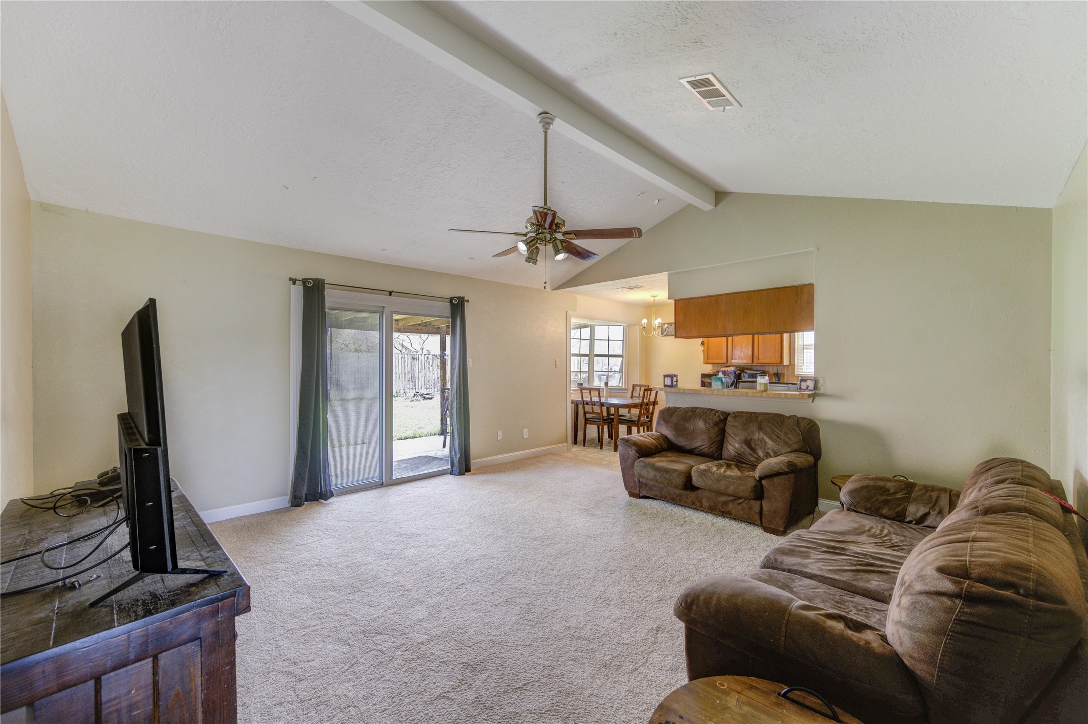 8610 Bluebonnet Street Highlands, TX 77562 - Photo 23 of 45 a living room with furniture and a flat screen tv