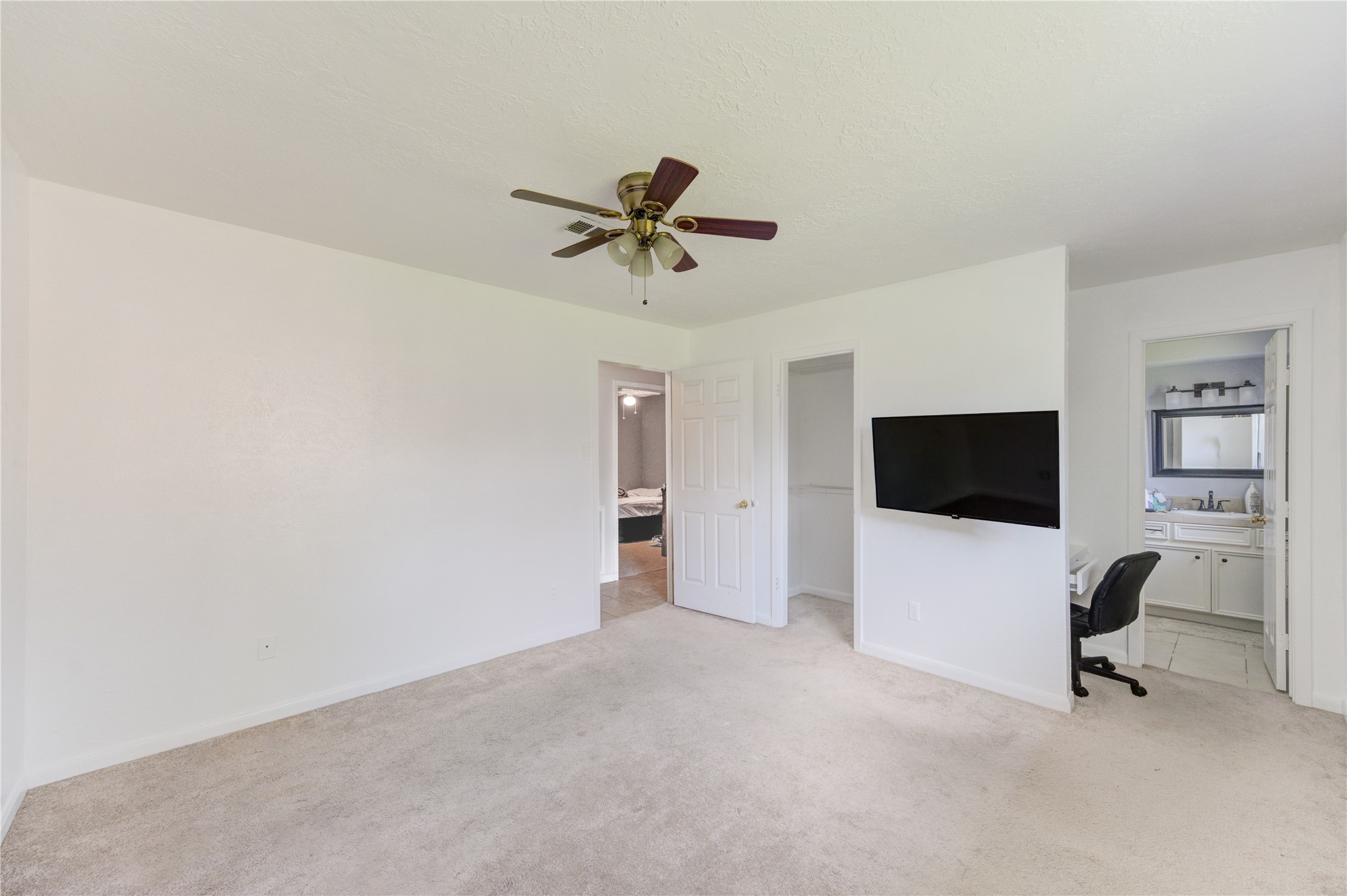 8610 Bluebonnet Street Highlands, TX 77562 - Photo 27 of 45 a view of a livingroom with a flat screen tv