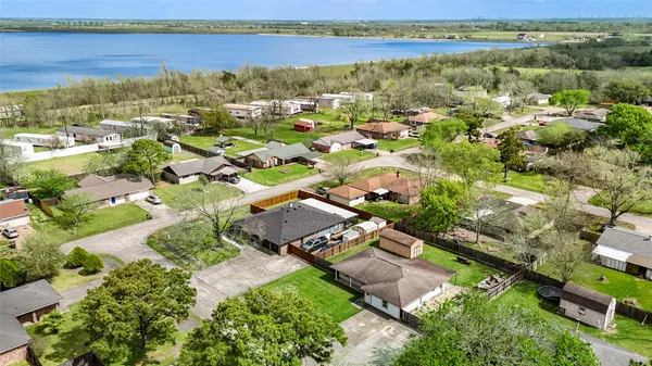 an aerial view of a house with outdoor space