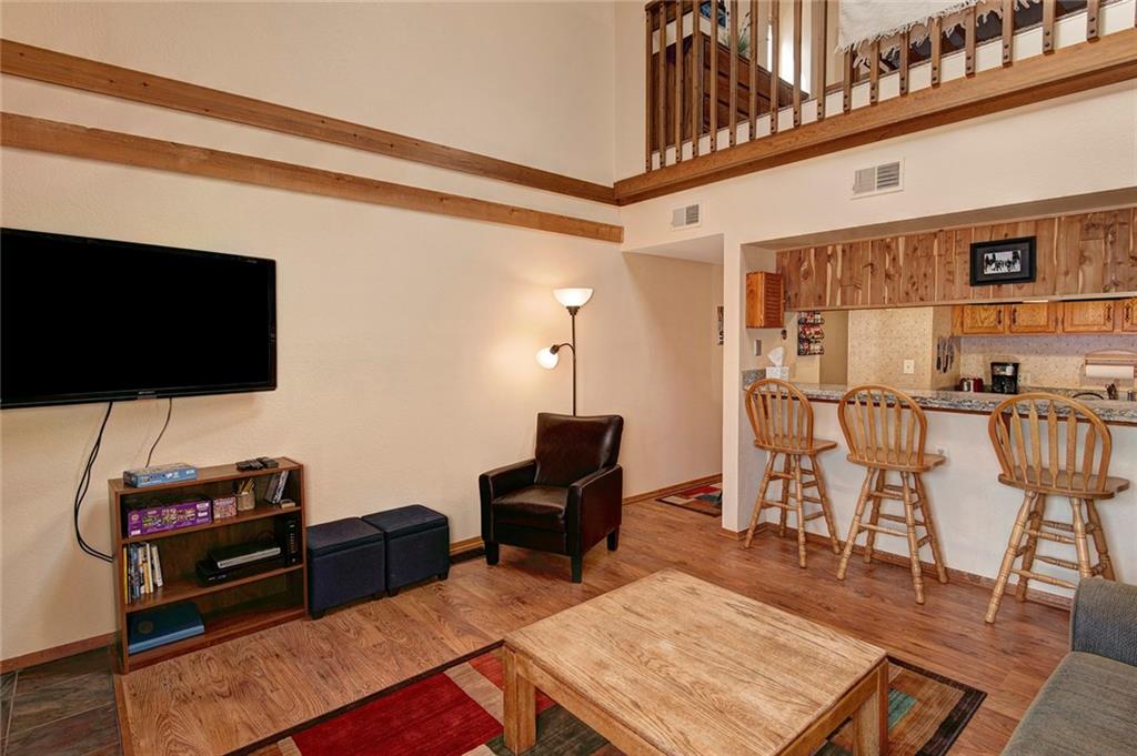 520 Bills Ranch Road, Unit 303 Frisco, CO 80443 - Photo 5 of 25 a living room with furniture and a flat screen tv