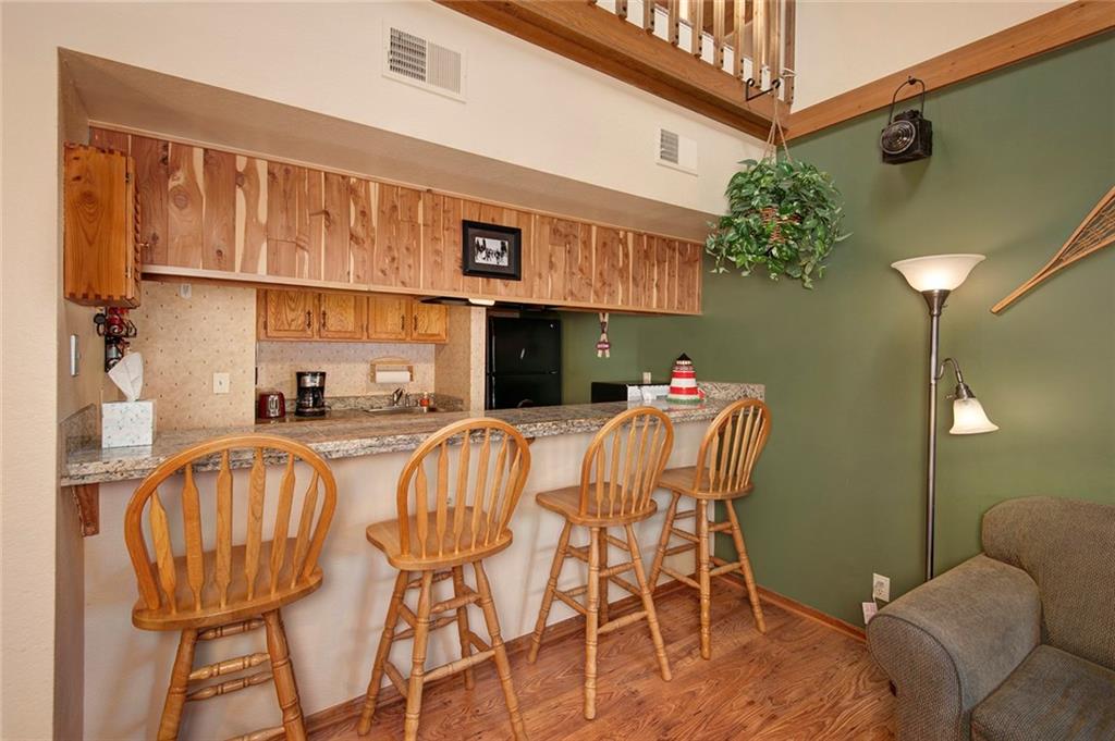 520 Bills Ranch Road, Unit 303 Frisco, CO 80443 - Photo 7 of 25 a dining room with furniture and a chandelier