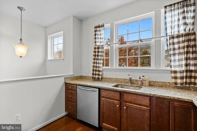a kitchen with a sink cabinets and window