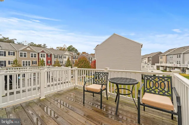 a view of a chairs and table on the deck