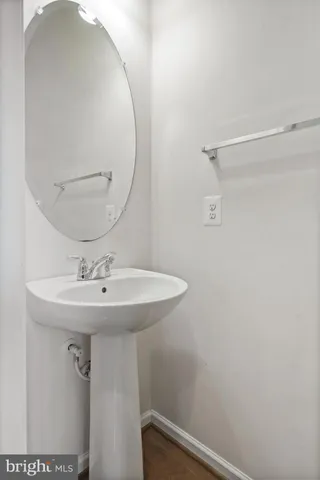 a bathroom with a sink and mirror