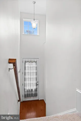 a view of entryway with wooden floor