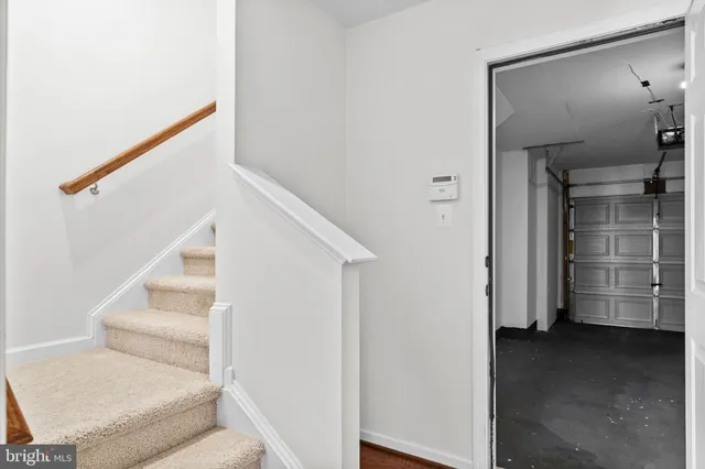 a view of entryway and kitchen